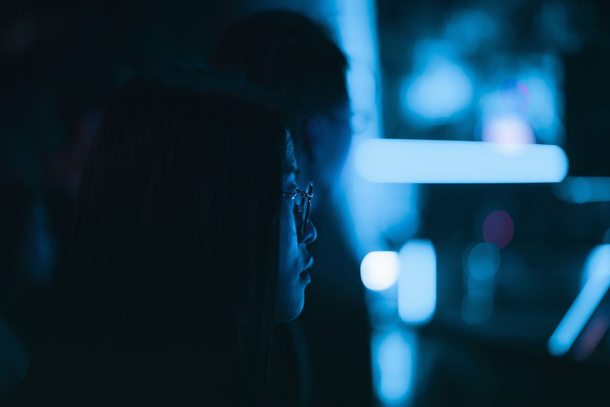 selective focus photography of woman wearing eyeglasses